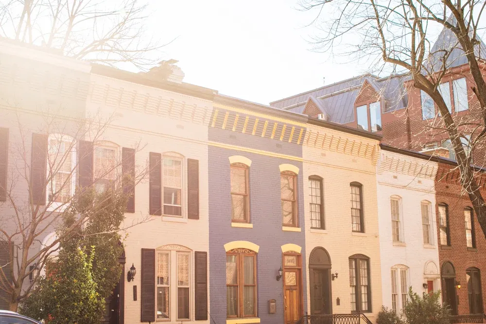 A sunlit historic hospitality building in Washington, DC