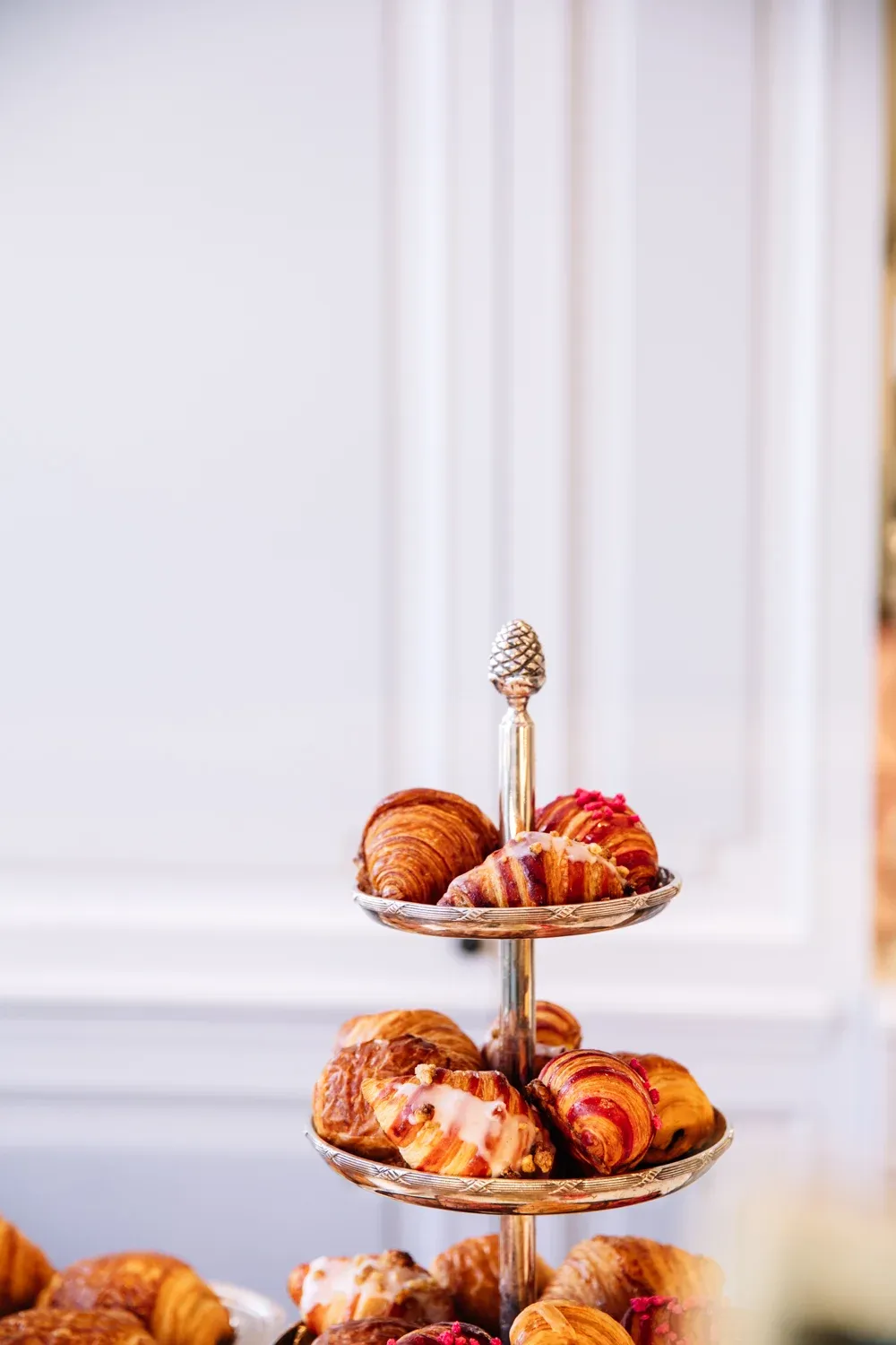 A tiered pastry stand in a bright hospitality setting